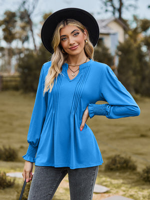 Sky blue blouse with pleated yoke and shirred cuffs