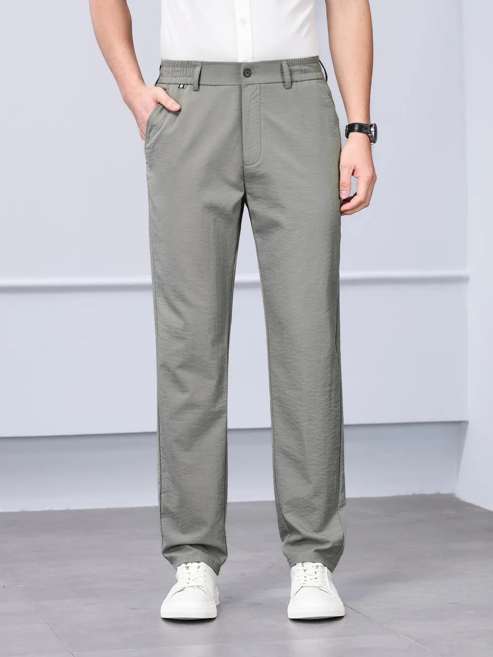 Men's gray classic fit sweatpants with elastic waistband and button closure.