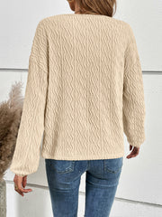 Textured ivory blouson sleeve henley top with button detail.