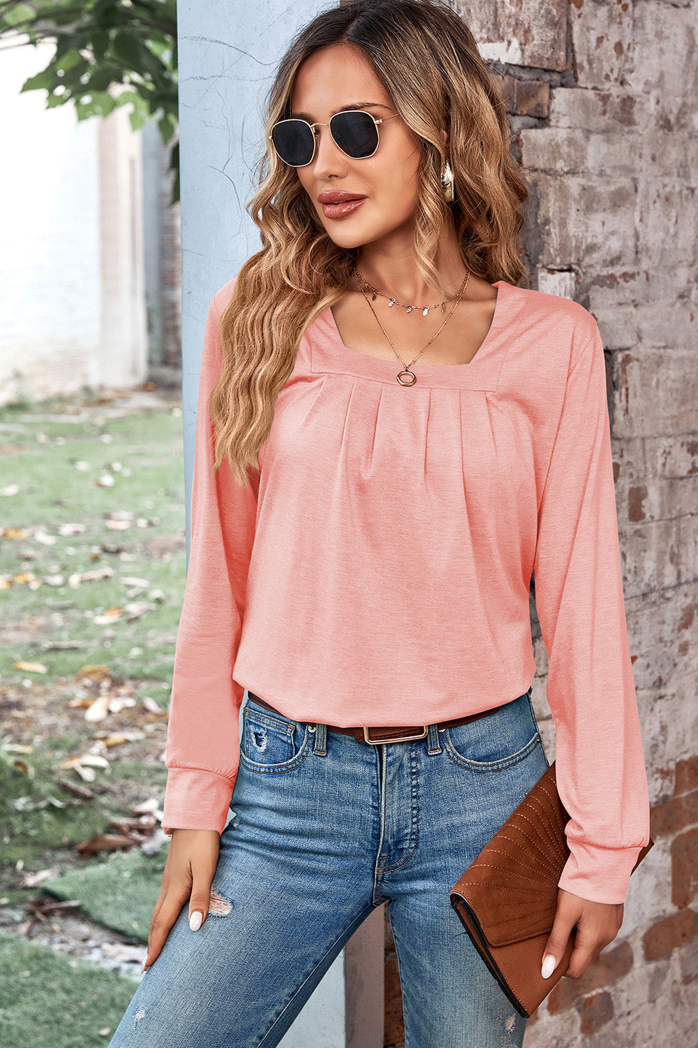 Watermelon pink long sleeve top with square neckline and subtle pleats.