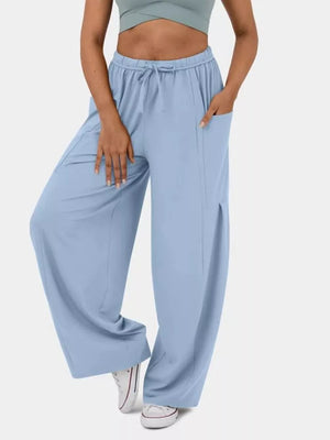 Light blue maternity pants with drawstring waist and wide legs.