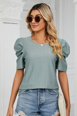 Teal perforated sleeve volume top with round neckline and puff sleeves
