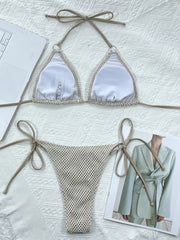 Crochet halter bikini set in ivory with tie sides and mesh bottoms.