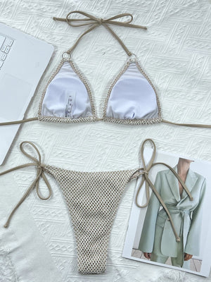 Crochet halter bikini set in ivory with tie sides and mesh bottoms.