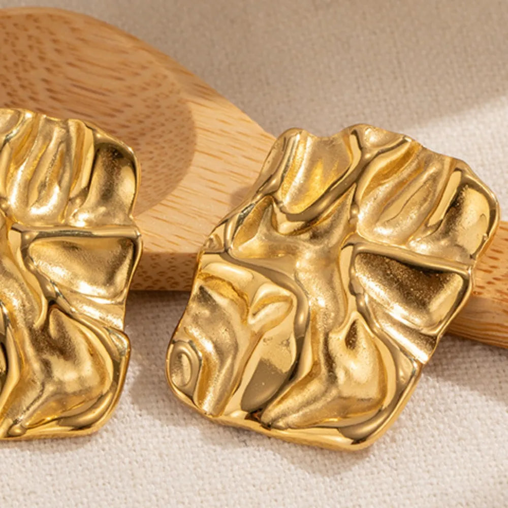 Textured gold sculptural stud earrings with 18K gold plating.