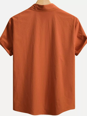 Orange textured cotton Cuban collar casual shirt with short sleeves.