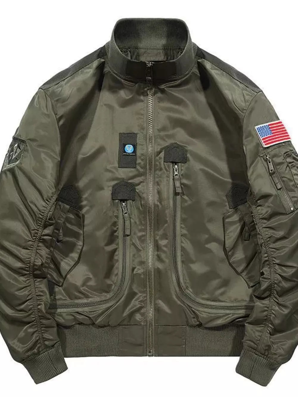 Army green bomber jacket with multiple zippered pockets, patches, and American flag detail.