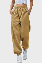 Slouchy sweatpants in tan with gathered cuffs and drawstring waist.