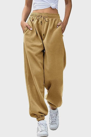 Slouchy sweatpants in tan with gathered cuffs and drawstring waist.