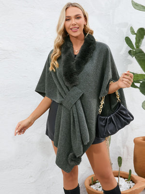 Gray faux fur collar wrap poncho with tie detail and pom-pom accent.