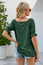 Gathered square neck blouse in Gum Leaf green with puff sleeves and ruffled cuffs.