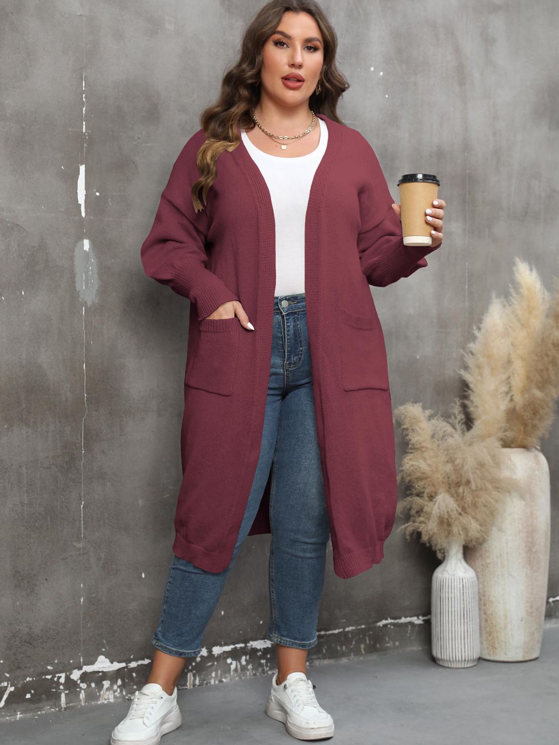 Burgundy oversized knit duster cardigan with patch pockets and long sleeves.