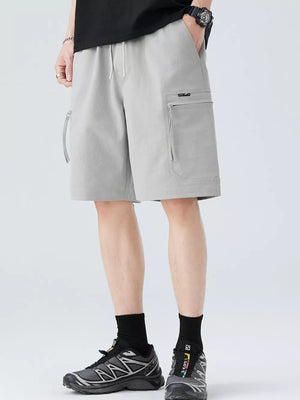 Light gray men's cargo shorts with zip pockets and drawstring waist.