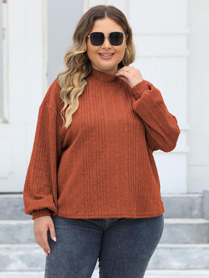 Textured mock neck sweater in Ochre with balloon sleeves and ribbed knit detail.