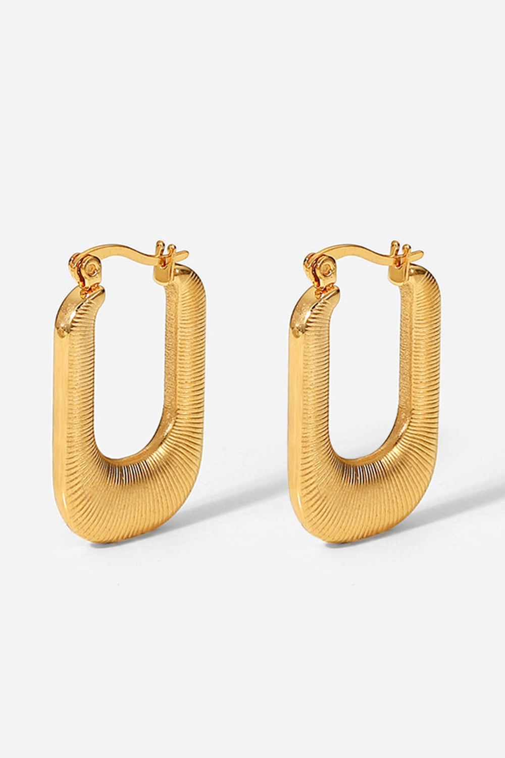 Textured rectangular gold hoop earrings with a ribbed surface detail.