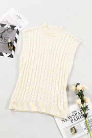 Ivory cable knit mock neck vest with chunky texture and ribbed trim.
