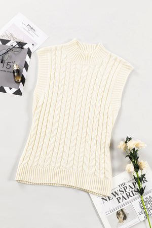 Ivory cable knit mock neck vest with chunky texture and ribbed trim.