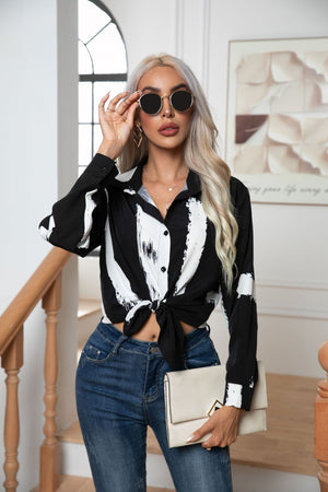 Black and white abstract brushstroke tie-front blouse with buttoned front and collar.