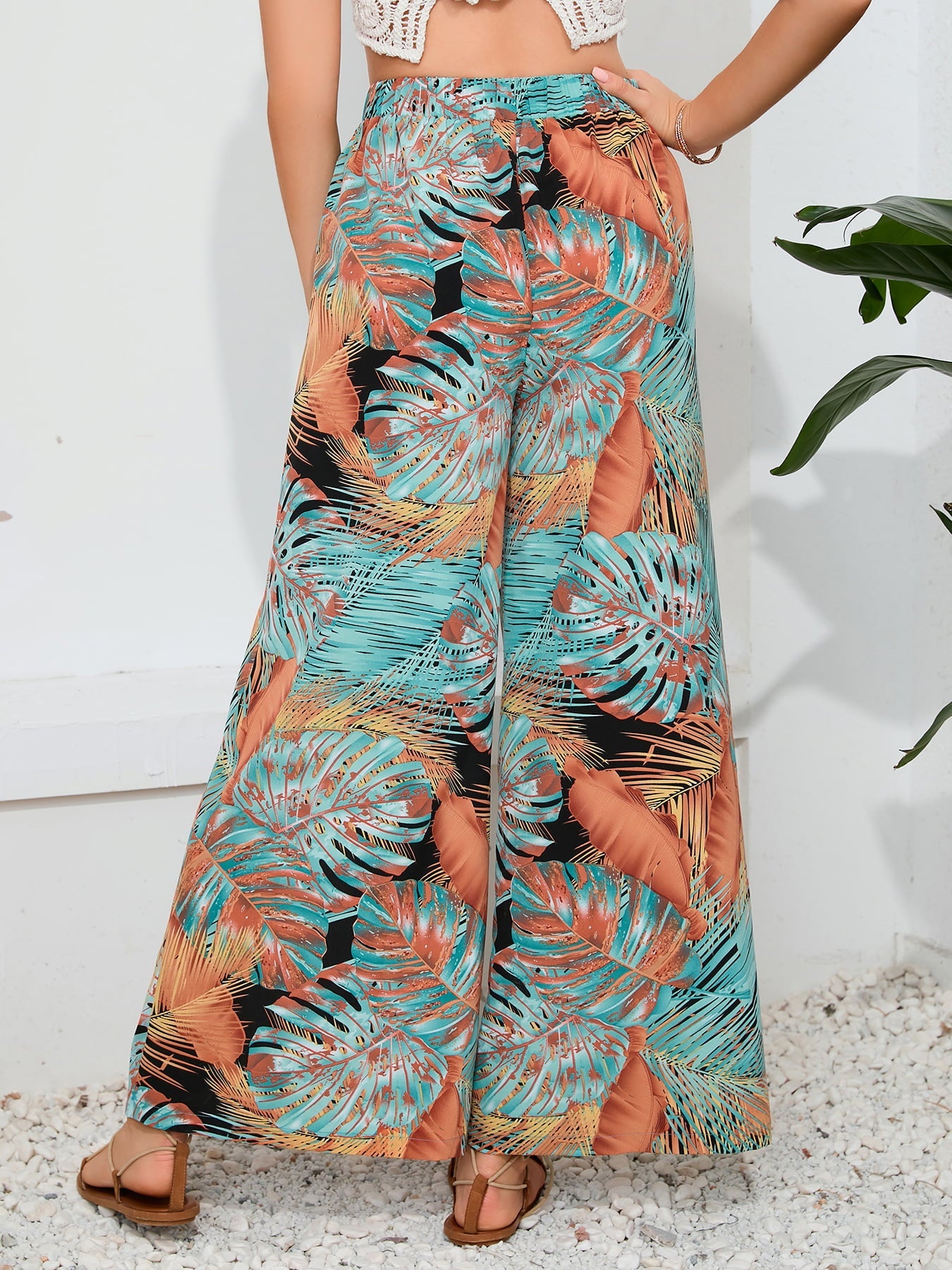 Tropical print palazzo trousers with a slit leg in multicolor.