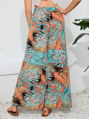 Tropical print palazzo trousers with a slit leg in multicolor.
