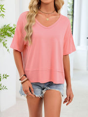 Pink relaxed fit v-neck t-shirt with short sleeves and a layered hem detail.