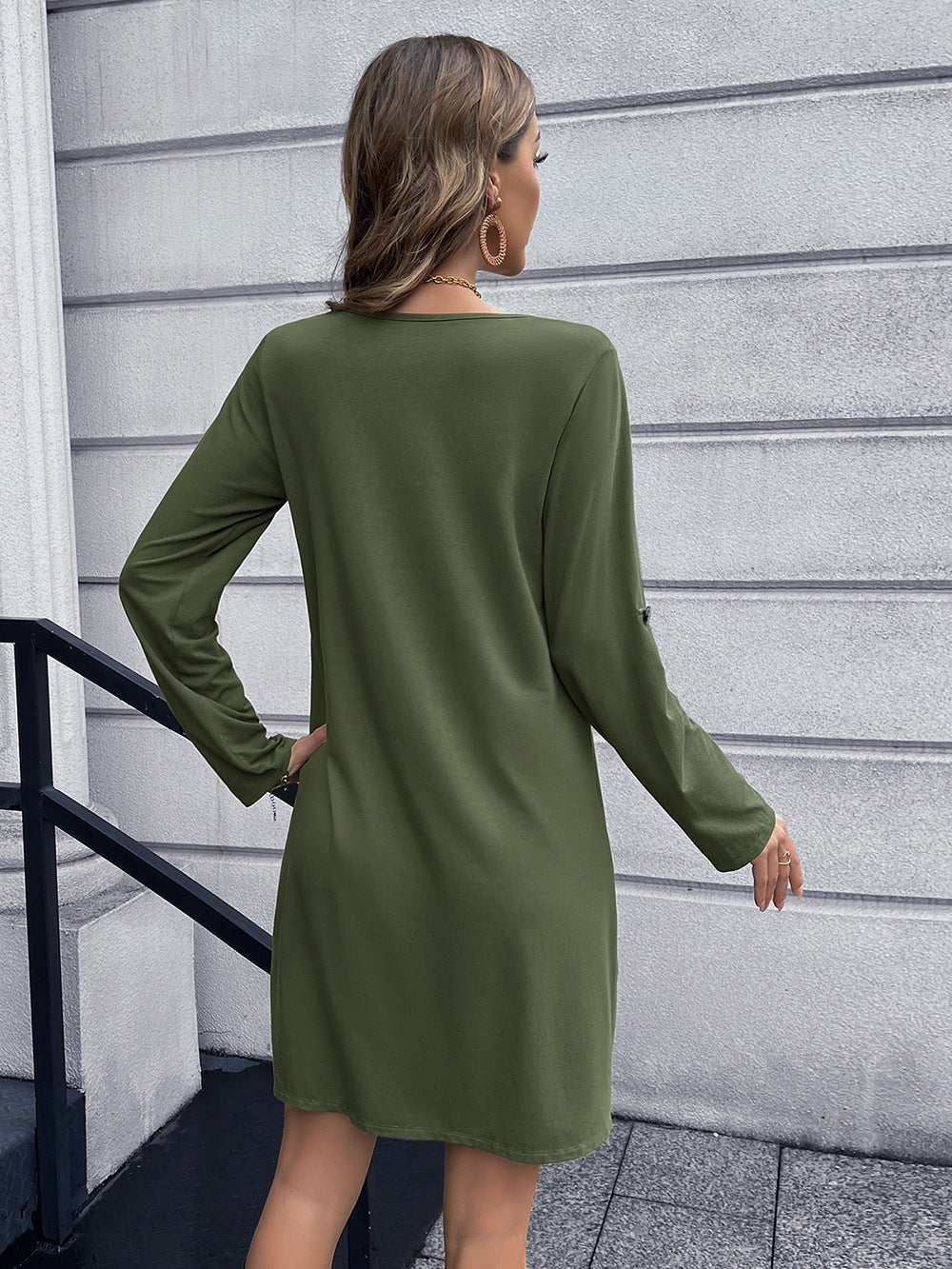 Olive green button-down mini dress with long sleeves and A-line cut.