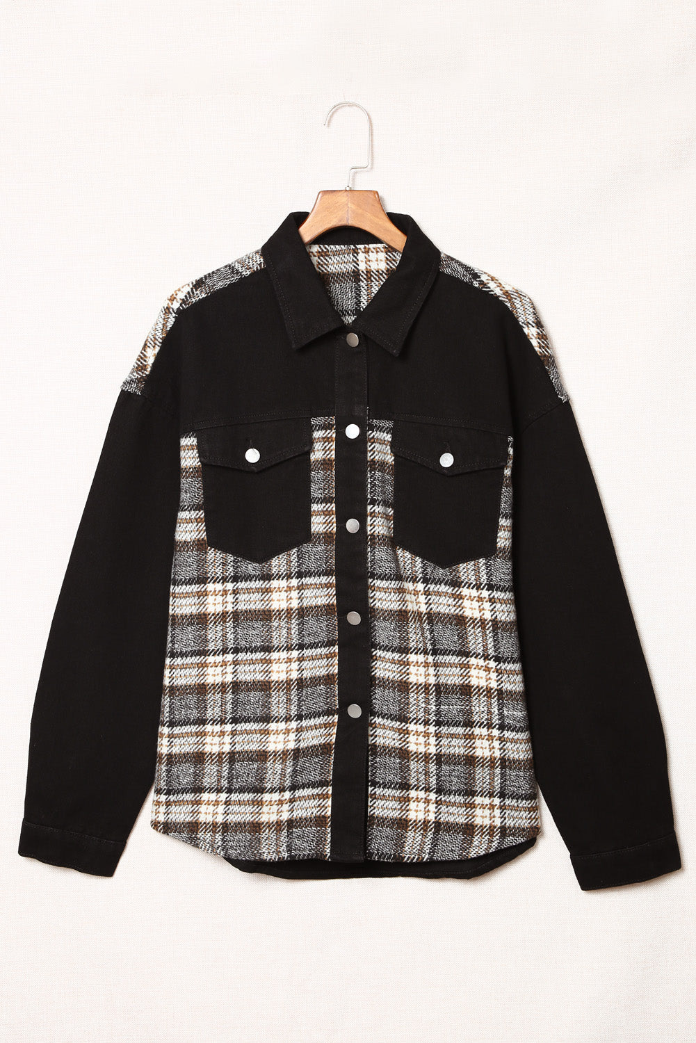 Plaid panel denim shirt jacket in black with plaid front and sleeves, button-up closure, and chest pockets.