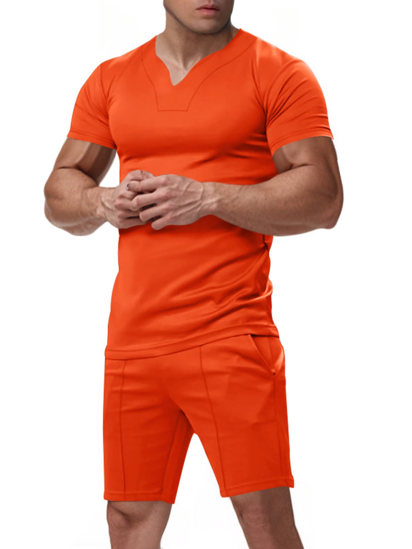 Orange v-neck tee with notched collar and matching shorts with pockets.