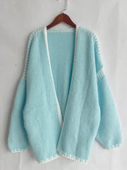 Tiffany Blue knit oversized cardigan with white contrast stitching and open front.