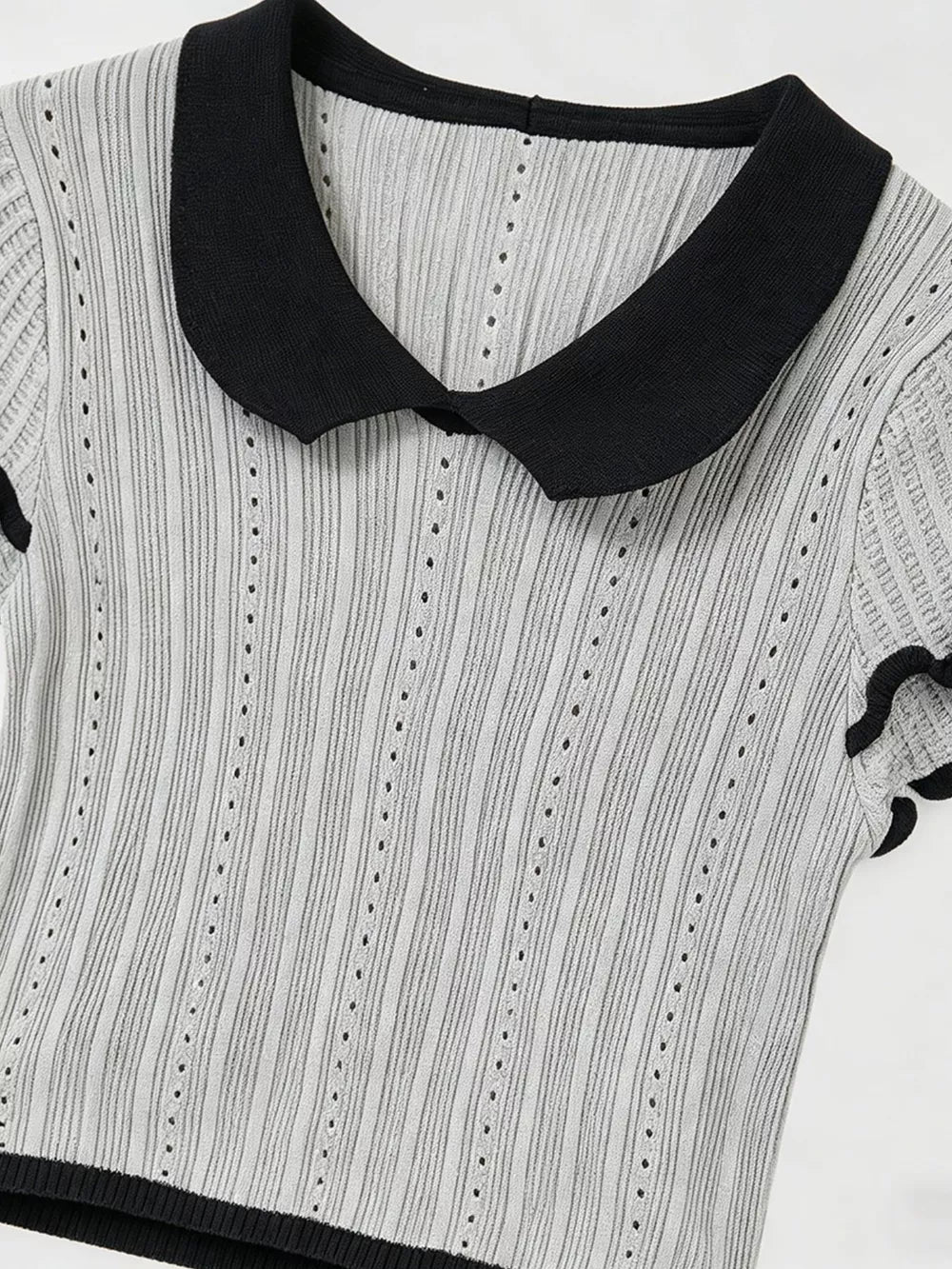 Gray knit maternity t-shirt with black Peter Pan collar and ruffled sleeves.