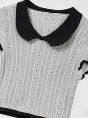 Gray knit maternity t-shirt with black Peter Pan collar and ruffled sleeves.