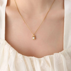 Gold necklace with delicate pearl charm pendant