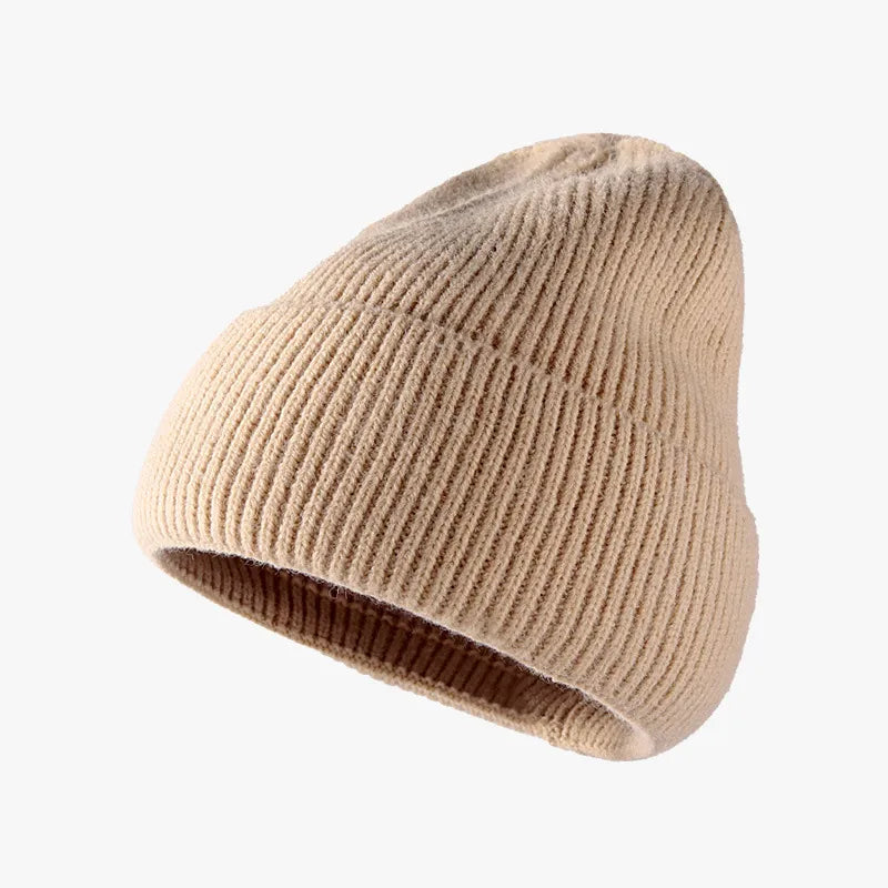 Tan ribbed knit slouch beanie with a casual, relaxed fit.