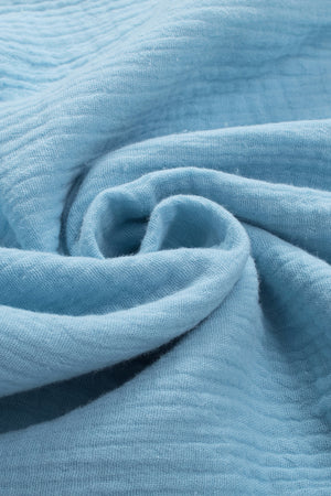 Pastel blue textured gauze blouse with gathered sleeve detail