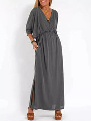 Gray V-neck maxi dress with dolman sleeves, elastic waist, and side slits.