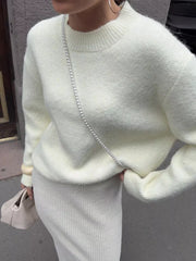 Cozy knit top in beige with relaxed fit and crewneck.