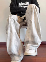 Off-white vintage wash utility cargo pants with drawstring detail and vertical stripe pattern