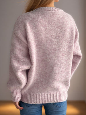 Oversized crewneck sweater in dusty pink textured knit with ribbed cuffs and hem.
