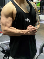 Black performance racerback tank top with white graphic detail on chest