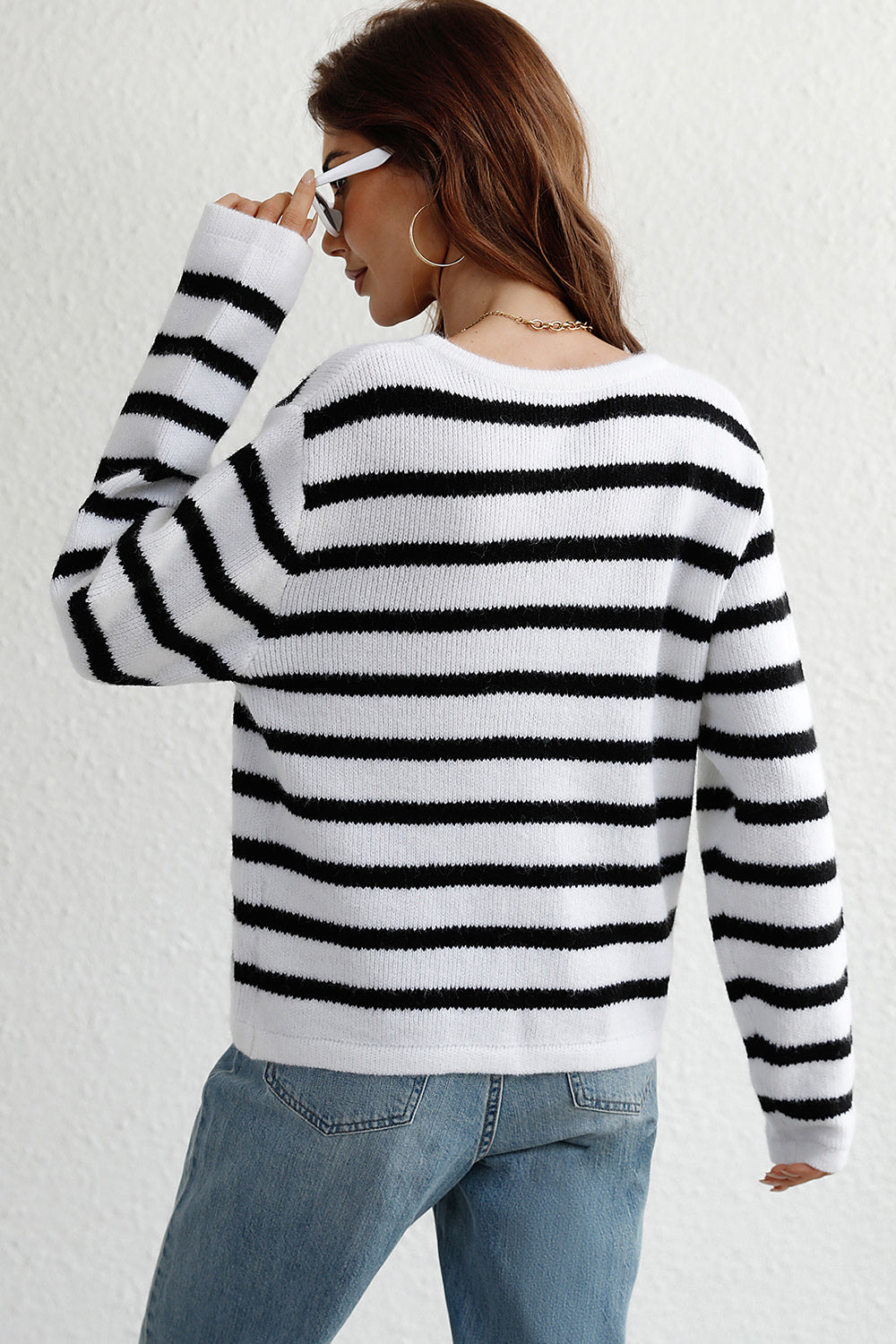 White and black striped knit cardigan with gold buttons
