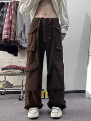 Brown cargo pants with multiple large pockets and a drawstring waist.