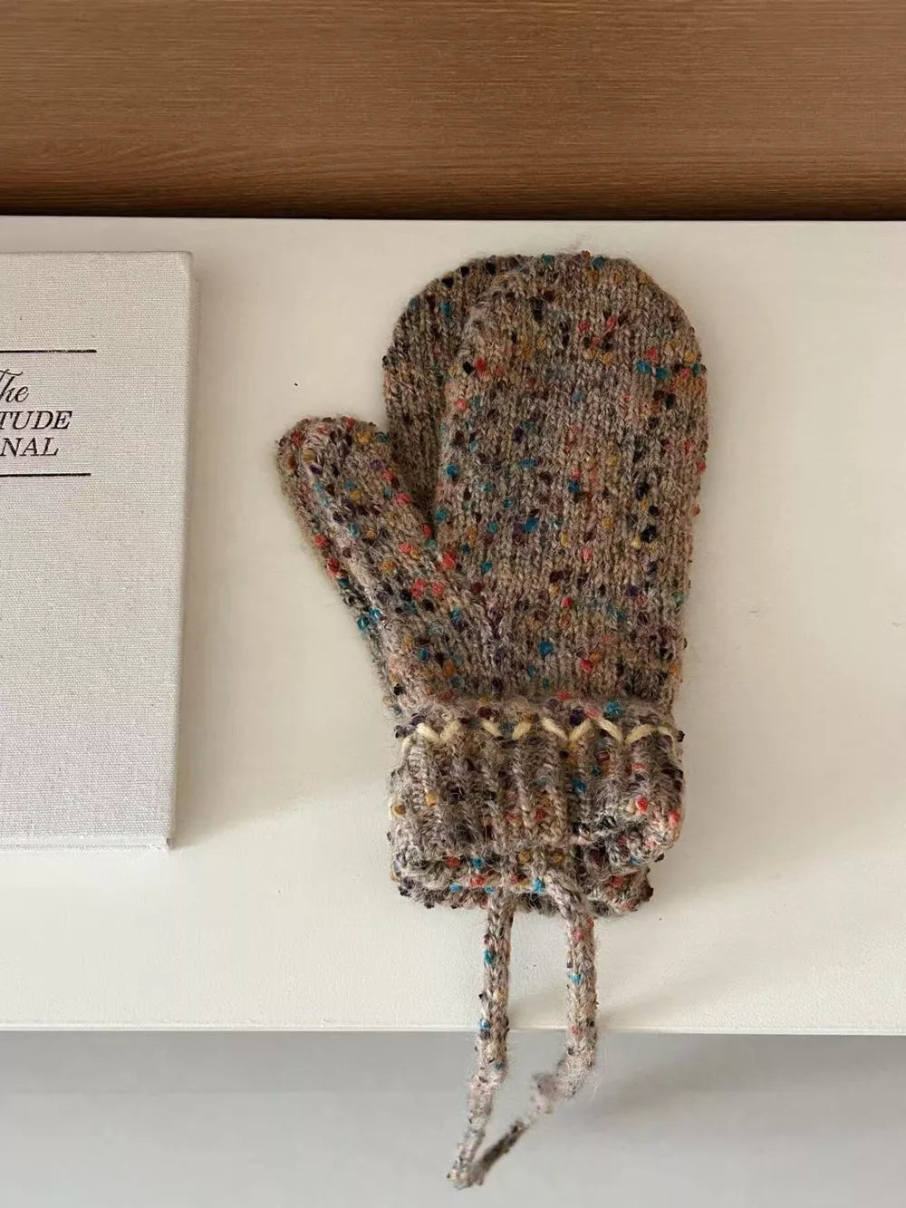 Textured knit mittens in Khaki with colorful speckles and zig-zag cuff detail.