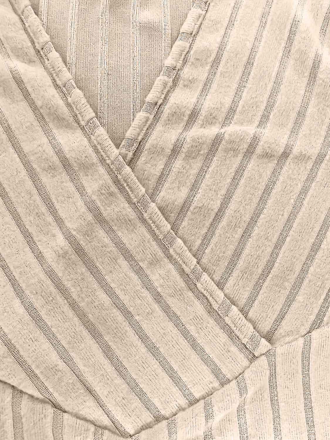 Ribbed wrap top in Caramel with a plunging neckline and pinstripe pattern.