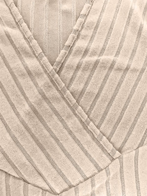 Ribbed wrap top in Caramel with a plunging neckline and pinstripe pattern.