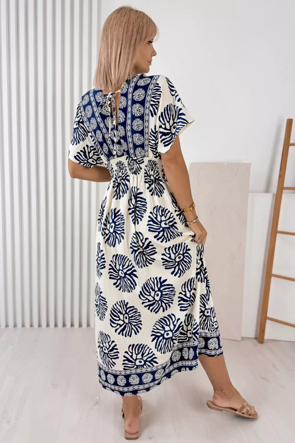 Blue floral print ankle length dress with V-neck and tie back detail