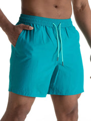 Teal swim shorts with contrast drawcord and side pockets.