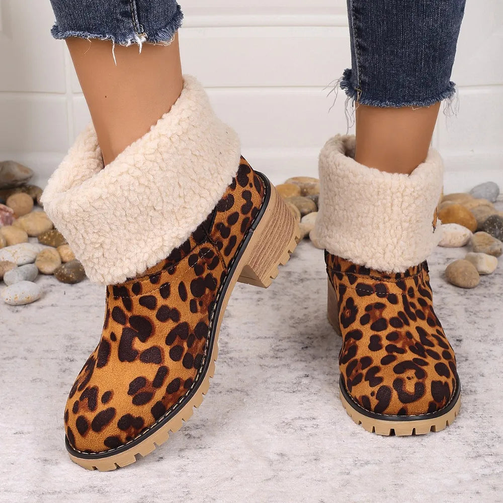 Red leopard print sherpa cuff booties with chunky heel and lug sole.