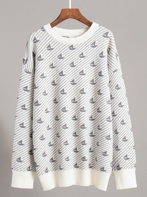 Sailboat jacquard knit sweater in off-white with grey sailboat pattern and striped detail.