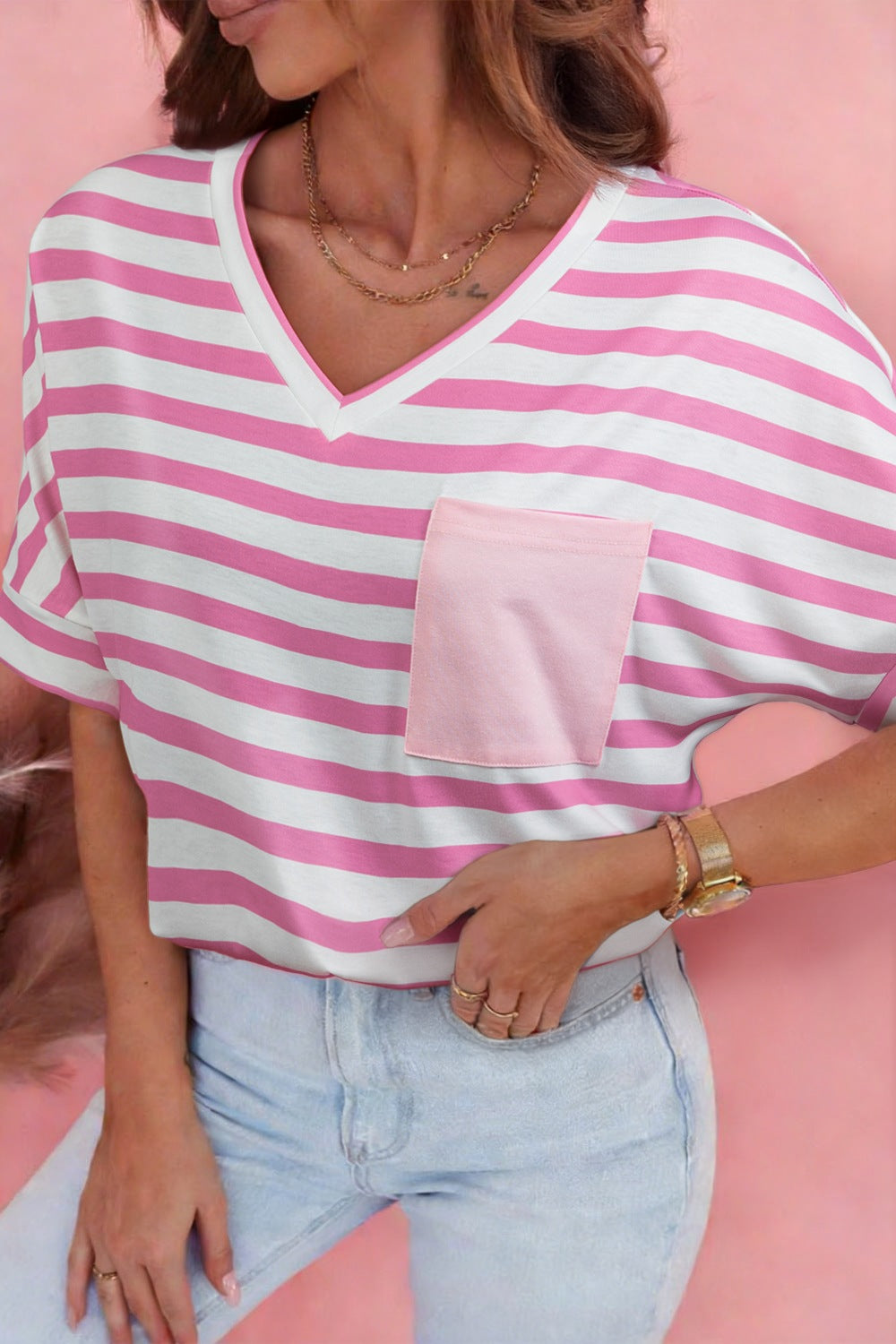 Striped V-neck t-shirt in blush pink and white with a contrast pocket.
