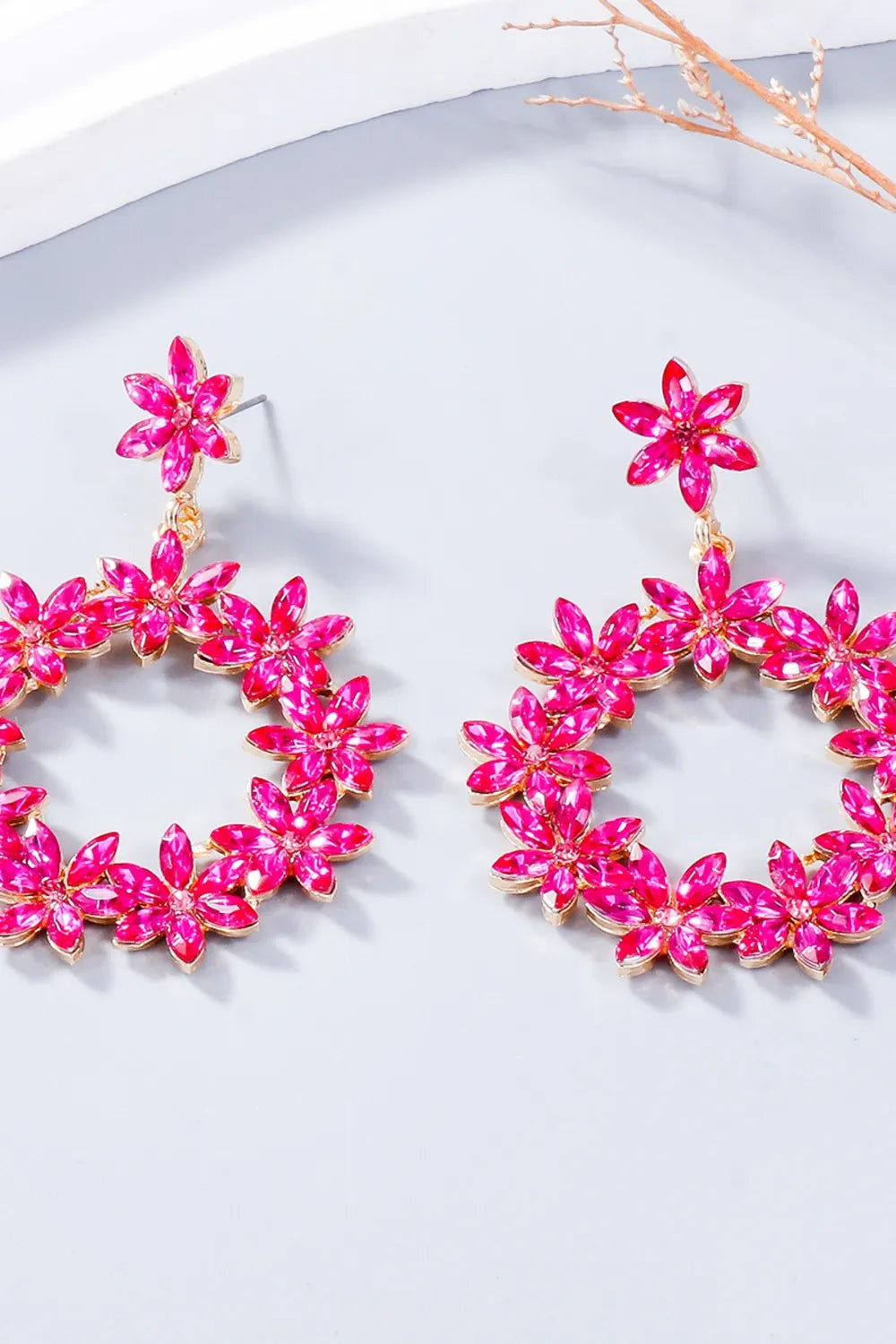 Hot Pink floral halo drop earrings with crystal flower details.